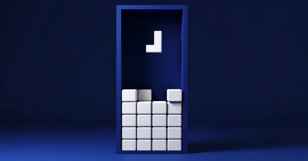 A 3D-rendered Tetris board with white blocks stacked six rows high inside a dark navy frame, one L-shaped piece falling from above into an unfilled gap — illustrating AI infrastructure demand outpacing the capacity being built.